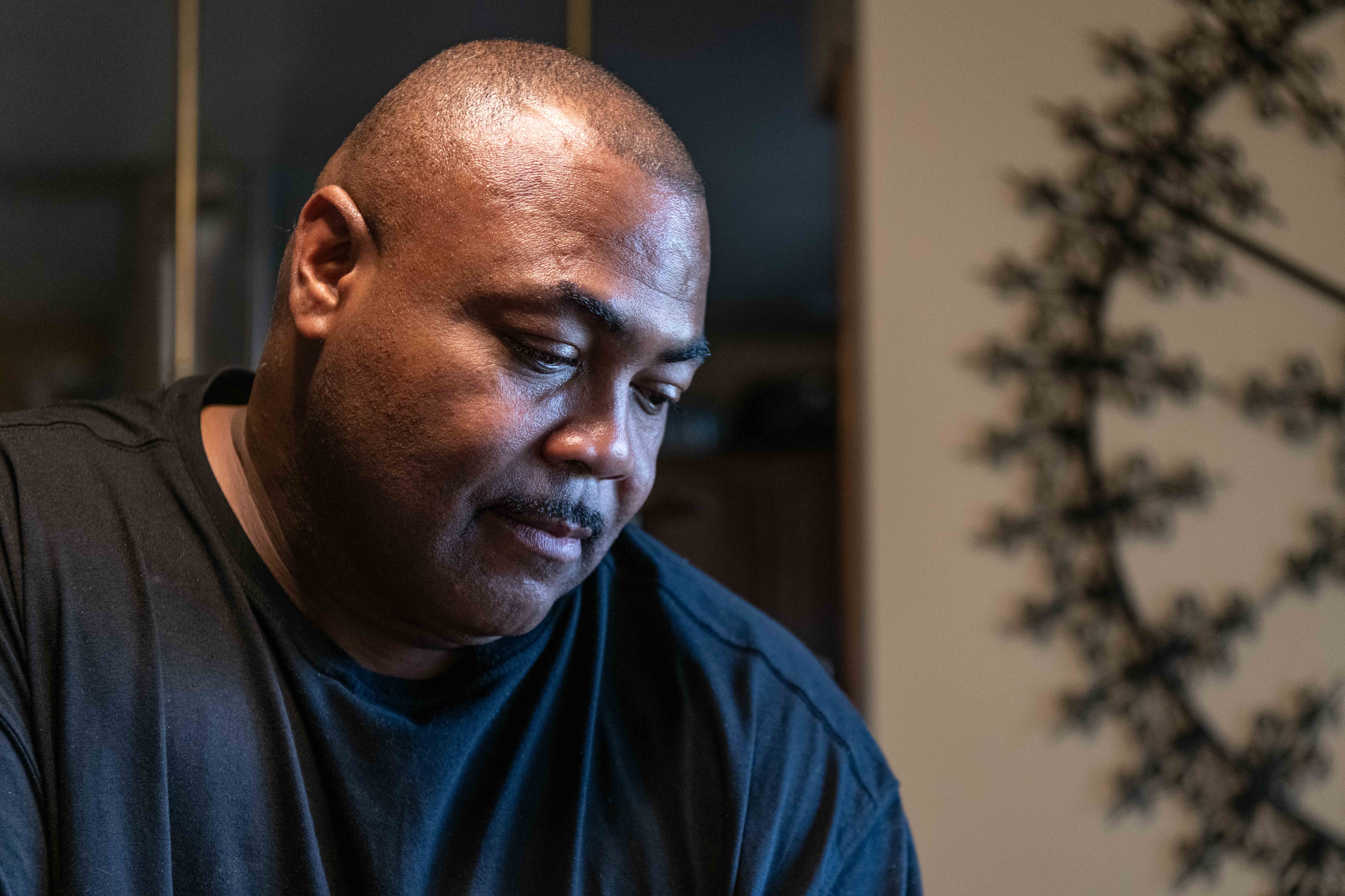 Marvin Miles looks over family albums, remembering his mother, Martha. Martha died on March 30, 2020, in the Bethany Pointe facility where she was recovering from a hip replacement, and family learned only from the death certificate that COVID was a factor. 