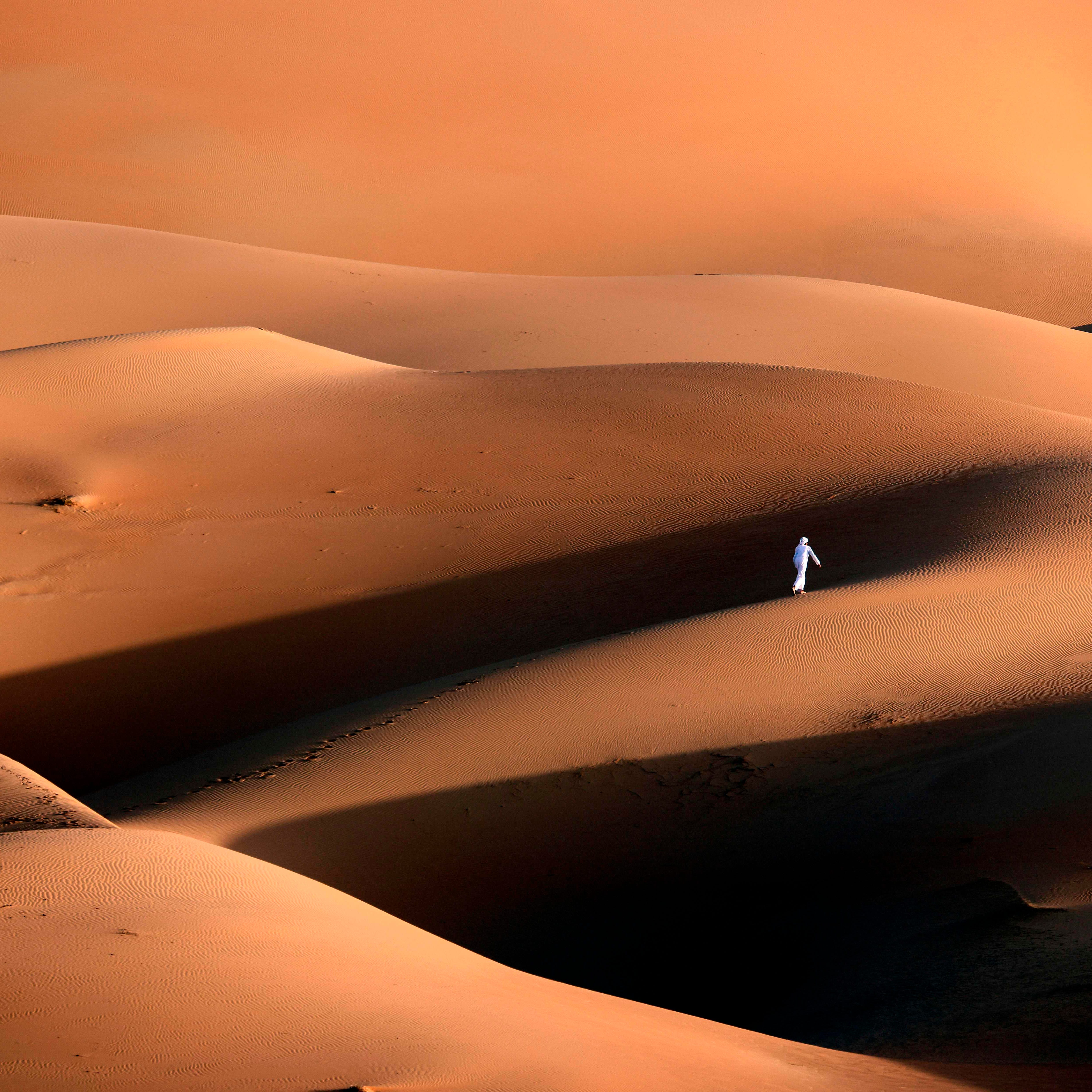 January 9, 2021: An Emirati youth plays in the sand dunes in the Liwa desert, some 250 kilometres west of the Gulf emirate of Abu Dhabi.