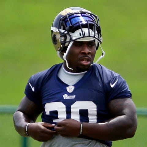 St. Louis Rams running back Zac Stacy pauses betwe