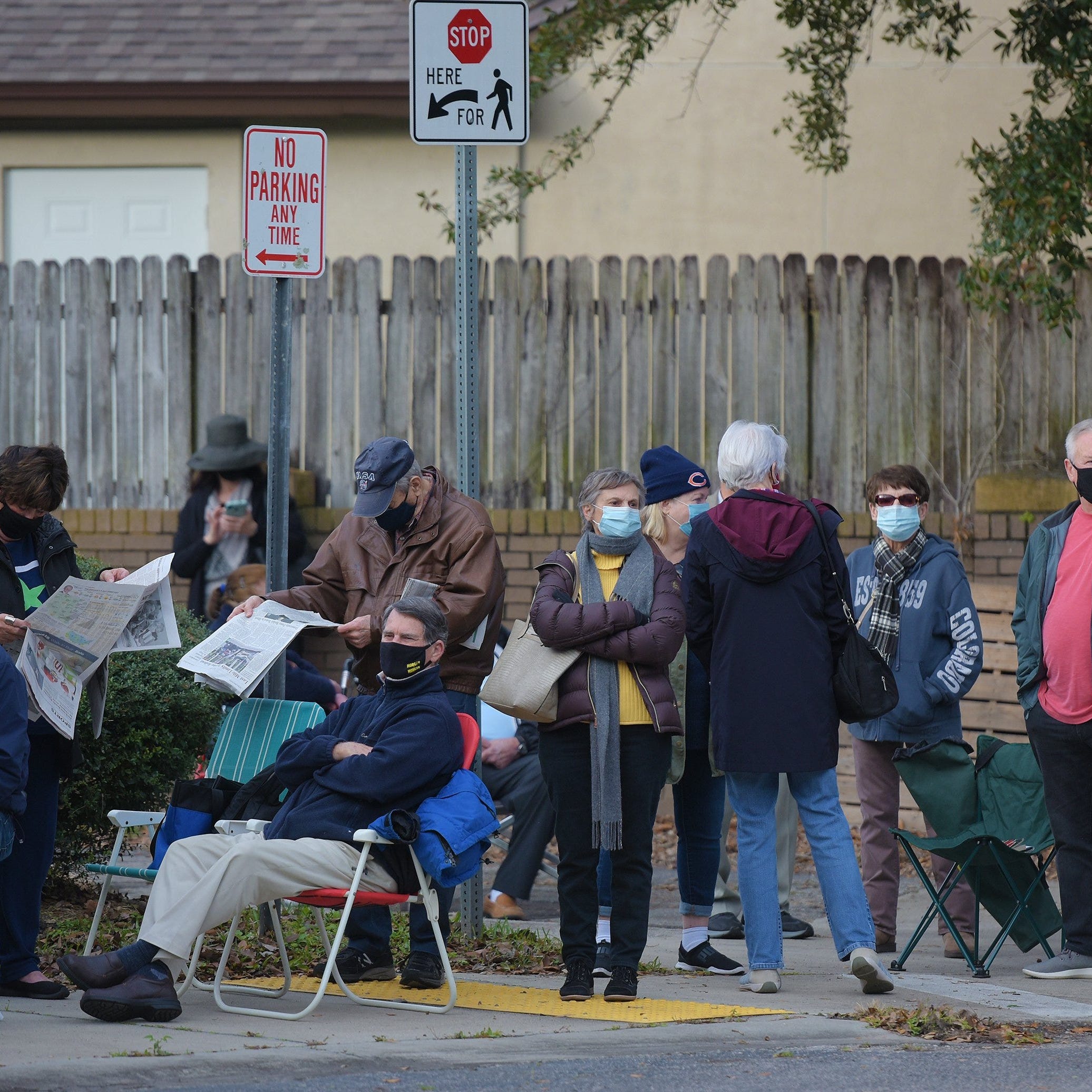 January 11, 2021: A line of Duval County residents snakes around the campus of the Mandarin Senior Center as they wait for COVID-19 vaccine injections at one of two new City of Jacksonville, Fla. vaccine sites.