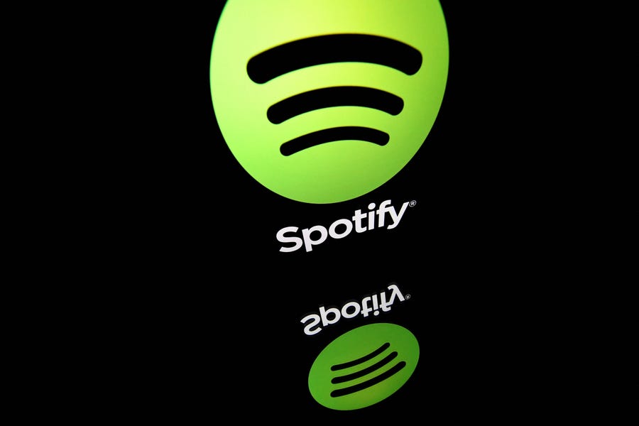 This file illustration taken on April 19, 2018 shows the logo of online streaming music service Spotify displayed on a tablet screen in Paris.
