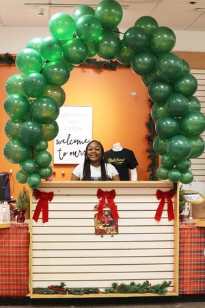Shaleah Gilmer, the founder and CEO of Black Owned Brockton, is at the Holiday Market at Westgate Mall on Friday, Nov. 19, 2021.