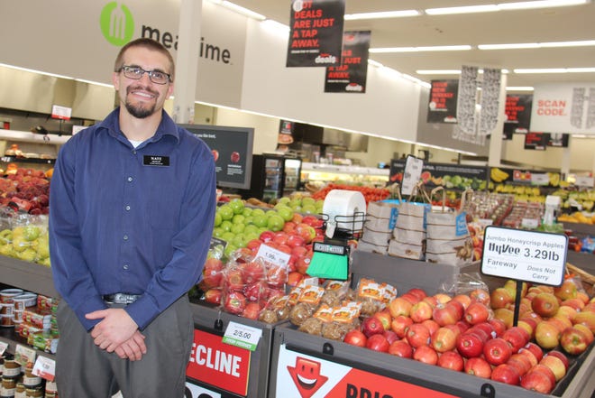 Perry Hy-Vee Store Manager Nate Brokaw poses for a photo inside the Perry store.