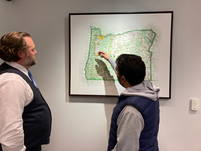 Local lawyer and veteran Bryan Boender and his friend Yasin at Boender's office. Yasin and his family have lived in Eugene for about a month after narrowly escaping Afghanistan.