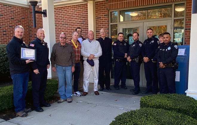 Members of the Clinton Police Department and the Knights of Columbus during a recent recognition ceremony.