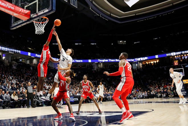 Ohio State Buckeyes forward E.J. Liddell (32) blocks a shot by Xavier Musketeers guard Colby Jones (3) in the first half of the NCAA basketball game between the Xavier Musketeers and the Ohio State Buckeyes at the Cintas Center in Cincinnati on Thursday, Nov. 18, 2021.