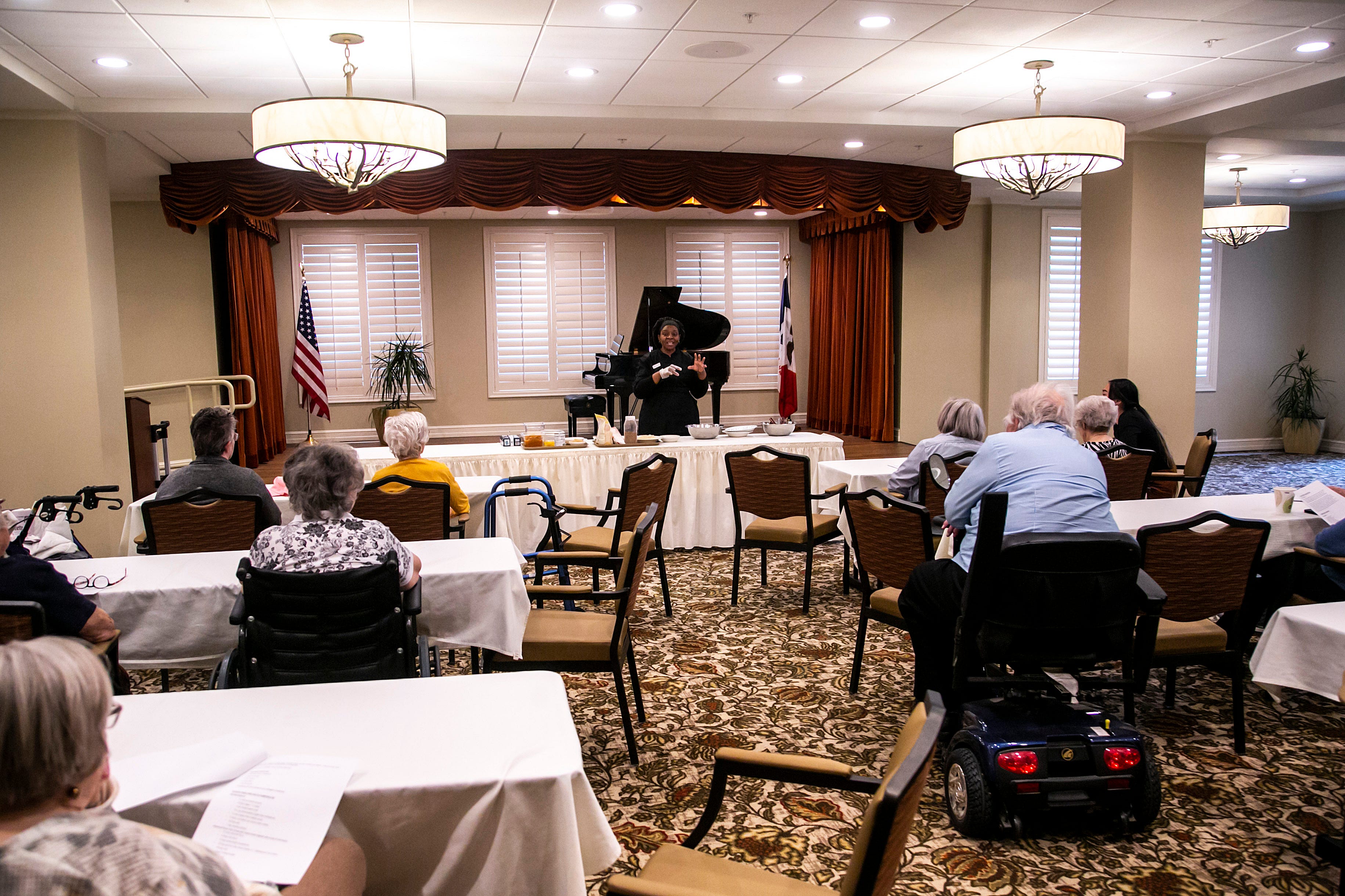 Chef Austina Smith speaks to residents during a Food for Thought class, Wednesday, Nov. 17, 2021, at Grand Living at Bridgewater in Coralville, Iowa.
