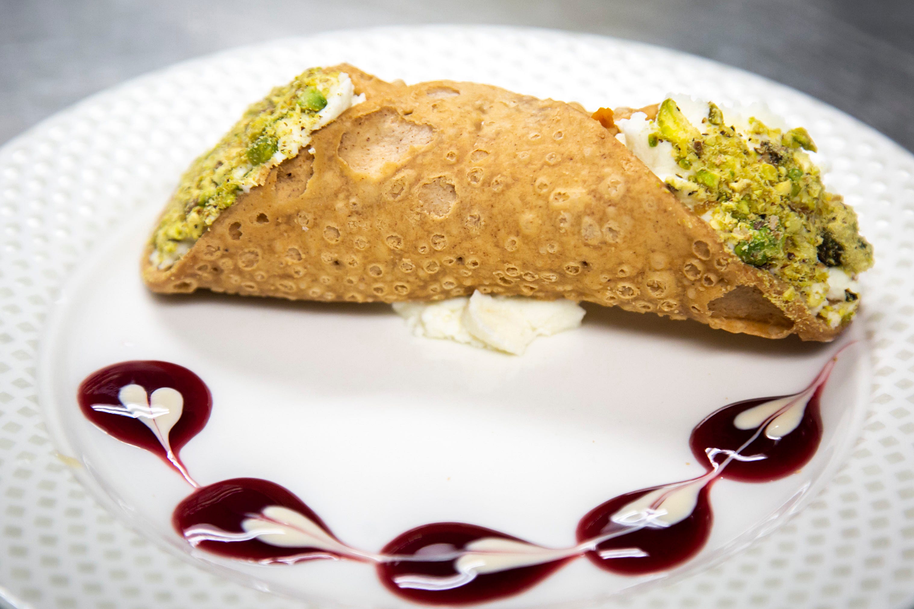 A cannoli with crushed pistachios is seen, Wednesday, Nov. 17, 2021, at Grand Living at Bridgewater in Coralville, Iowa.