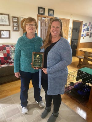 Norma (left) and Rebecca (right) Fielding holding their District 3 Winner Charles Deam Forest Stewardship Award, Nov. 18, 2021