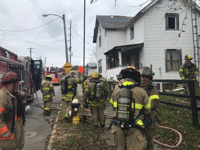 Numerous Mansfield firefighters responded to a report of a man trapped inside a burning house Friday morning at 646 Springmill St. Firefighters walked the man outside to safety.