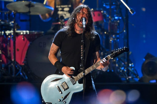 Dave Grohl performs with the Foo Fighters during the Rock & Roll Hall of Fame induction ceremony, Sunday, Oct. 31, 2021, in Cleveland.