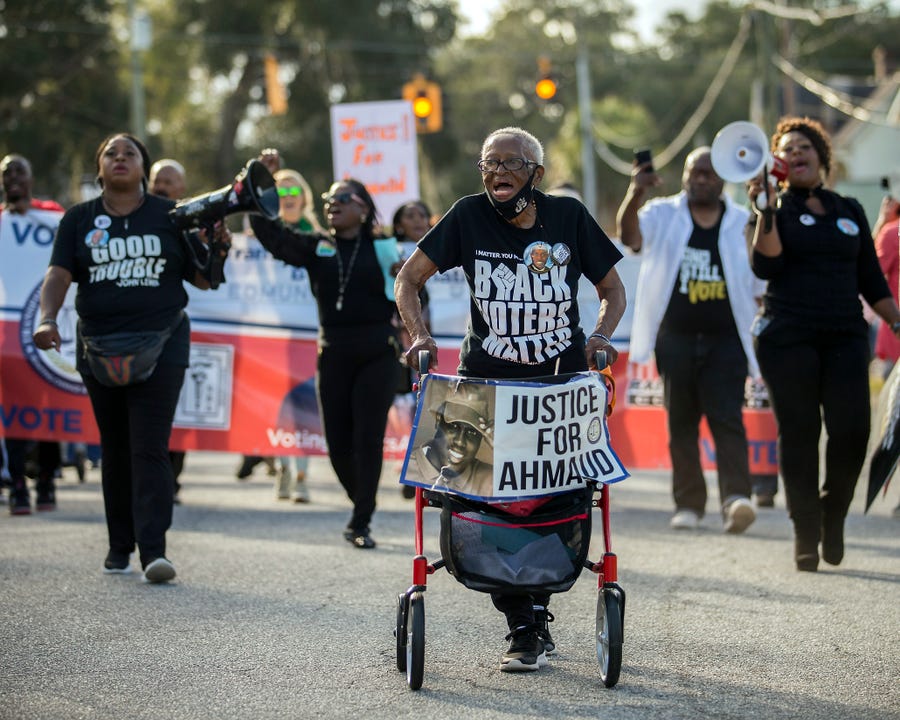 Annie Polite, 87, marches with her walker at the front of a protest outside the Glynn County Courthouse on Nov. 18 in Brunswick, Ga.