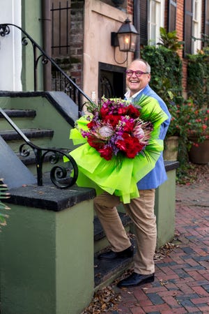 'Buy Flowers:' The vivid bouquet reflects John Davis's colorful personality in this image, one of photographer John Alexander's favorites that he snapped of the florist over the years.