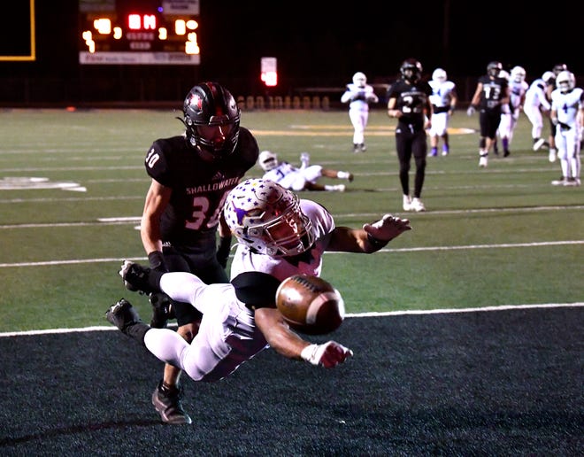 Early High School running back Tre Beam dives for an end zone pass out of reach as Shallowater defensive back Raston Copeland chases during Friday's playoff game at Clyde High School. Final score was 43-14, Shallowater.