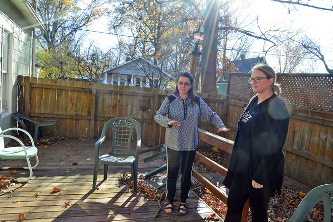 Janet Davis, left, The Center Project board member and facilities coordinator, explains how a deck will be replaced to allow for greater wheelchair access to the center's location at 805 Fairview Ave., while joined by board President Christi Kelly. The Center Project recently received a $77,600 grant to renovate and update the facility from the Veterans United Foundation as part of the foundation's 10 Years of Giving campaign.