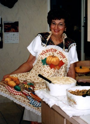 Anna Meckstroth wears an apron made in 1998 by her daughter, Janet Meckstroth.