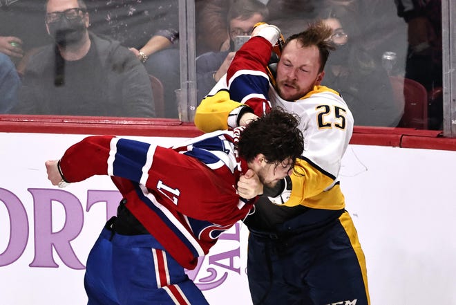 The Predators' Mathieu Olivier, right, fights Montreal's Josh Anderson, a former Blue Jackets forward, on Nov. 20.