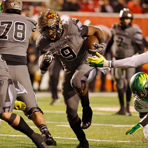 Utah running back Tavion Thomas (9) runs for a fir