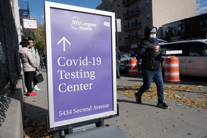 A sign outside of a hospital advertises COVID-19 testing  in New York City.