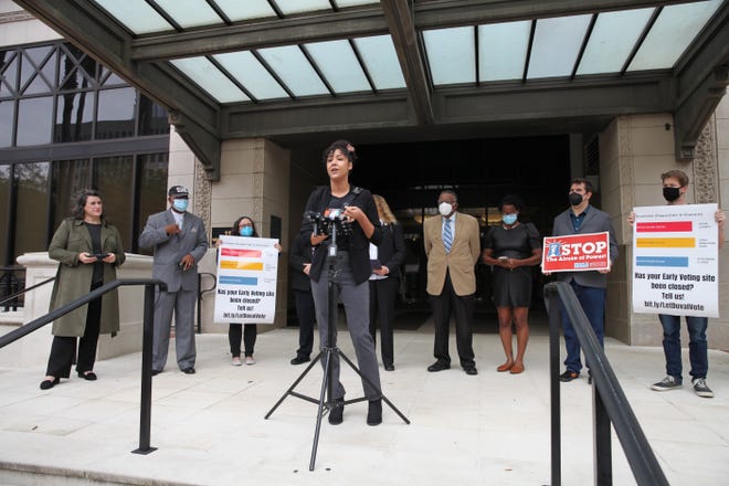 Christina Kittle, an activist with Florida Rising and the Jacksonville Community Action Committee, speaks at a news conference held outside Jacksonville City Hall on Monday, Nov. 22, 2021. Activists and pastors in Duval are calling for Duval County Supervisor of Elections Mike Hogan to expand access to early voting.