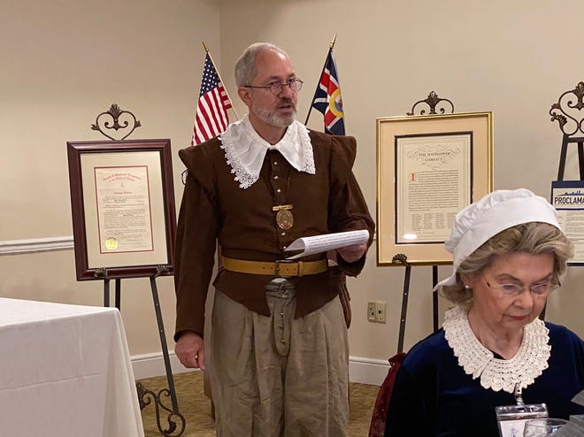 William Cheshire is governor of the Northeast Florida colony of Mayflower descendants, which marked the 400th anniversary of Thanksgiving earlier this month. The group invited a Middle Eastern family that emigrated to the United States after escaping religious persecution in their native land. In the foreground is colony secretary Carolyn Gentry.