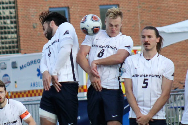 University of New Hampshire players, from left, Victor Menudier, Johann von Knebel and Bridger Hansen defend a free kick during the Wildcats' 4-1 NCAA men's soccer round of 32 tournament win over North Carolina in Durham Sunday, Nov 21, 2021.