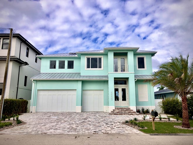 This custom home by Sinclair Custom Homes was just completed on Matlacha. It features modern conveniences and a special tribute.