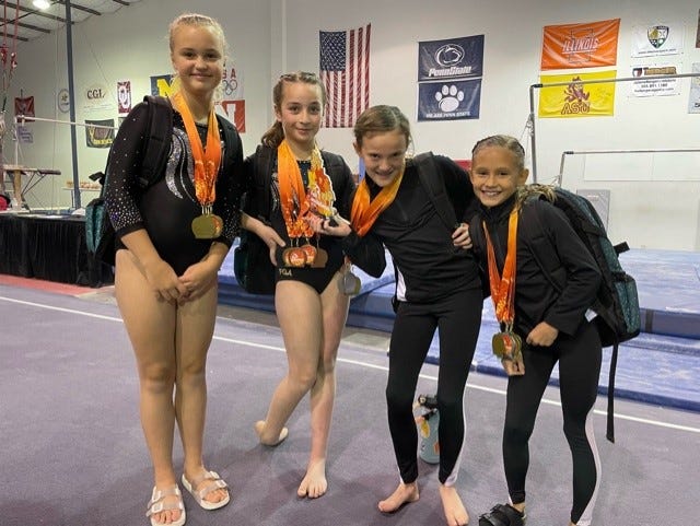 Farmington Gymnastic Academy's Raelynn Paschall, Emylia Dibble, Alli Fuller & Avaya Hatch (left to right) took home medals in a statewide competition last weekend in Rio Rancho.