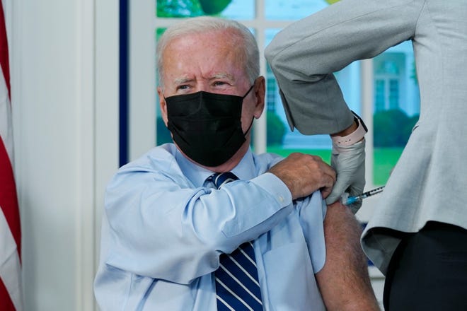 September 27, 2021: President Joe Biden receives a COVID-19 booster shot during an event in the South Court Auditorium on the White House campus in Washington, DC.
