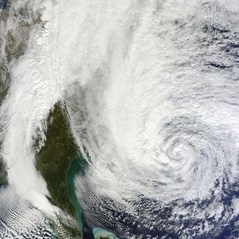 A satellite image shows Hurricane Sandy spinning o