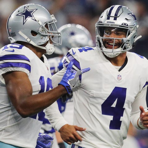Dak Prescott #4 of the Dallas Cowboys celebrates w