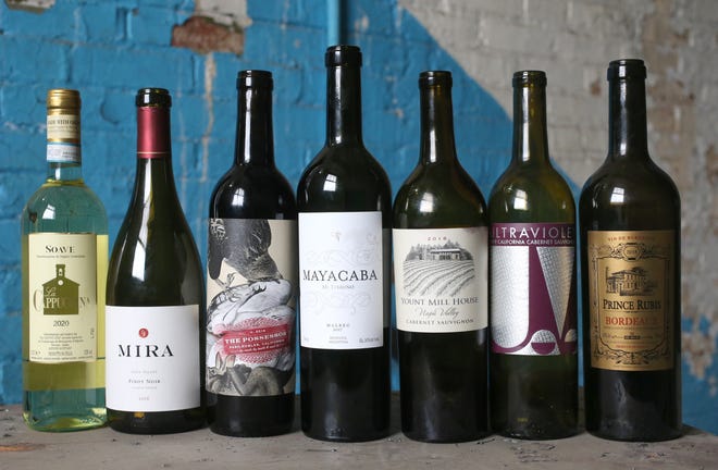 Feast of the 7 Delicious wines, unveiled on Monday: from left, Soave; Mira pinot noir; Tooth & Nail's The Possesser red blend; Mayacaba malbec; Yount Mill House cabernet; Ultraviolet cabernet; and Prince Rubis Bordeaux.