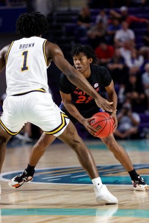 Florida guard Tyree Appleby (22) makes a move on California guard Joel Brown (1) during the first half of an NCAA college basketball game on Monday, Nov. 22, 2021, in Fort Myers, Fla. (AP Photo/Scott Audette)