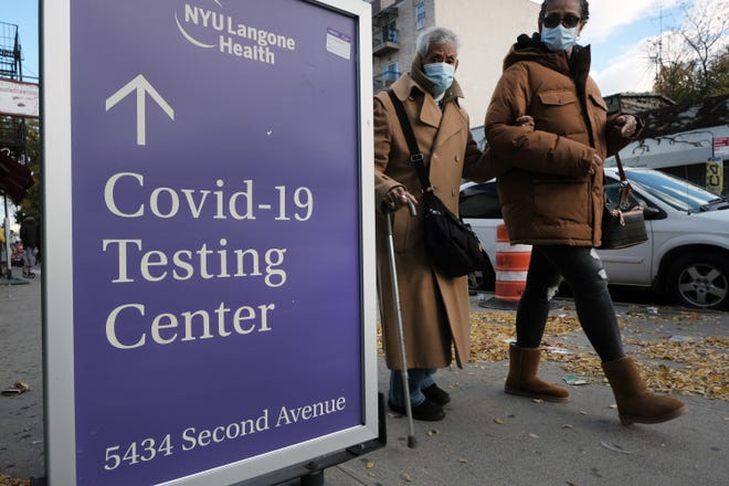 A sign outside of a hospital advertises COVID-19 testing on Friday, Nov. 19, 2021 in New York City. On Friday, vaccine advisers to the U.S. Centers for Disease Control and Prevention voted unanimously in recommending a booster shot of the COVID-19 vaccines for all adults in the United States six months after they finish their first two doses. (Spencer Platt/Getty Images/TNS)