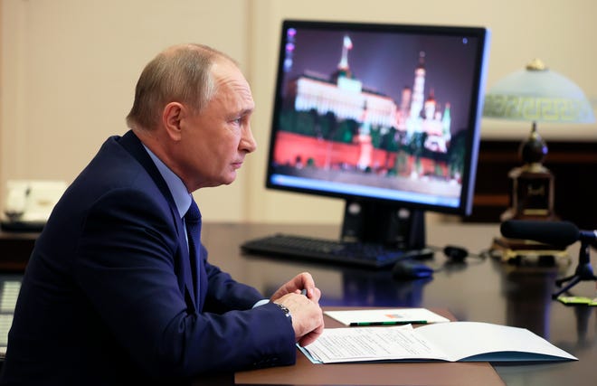 Russian President Vladimir Putin attends a cabinet meeting via videoconference at the Novo-Ogaryovo residence outside Moscow, Russia, on Nov. 10, 2021.