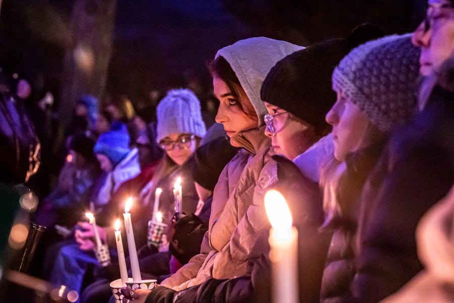 People gather in Cutler Park for a candlelight vigil  for those affected by the Christmas parade tragedy Nov. 22 in Waukesha, Wis.