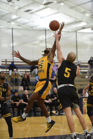 Siena Heights' Curtis Bell III goes up for a layup during Tuesday's game against Adrian College.