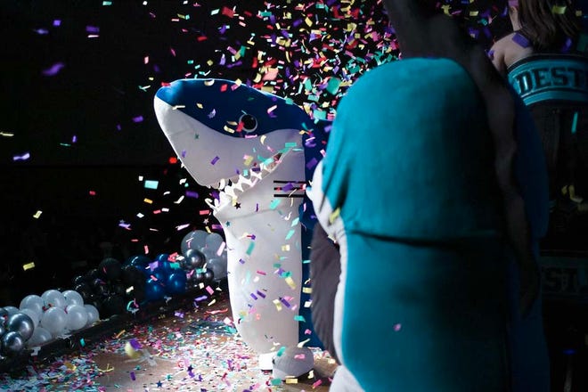 Destin High School's Shark mascot is reavealed during a town hall meeting last year in Destin.