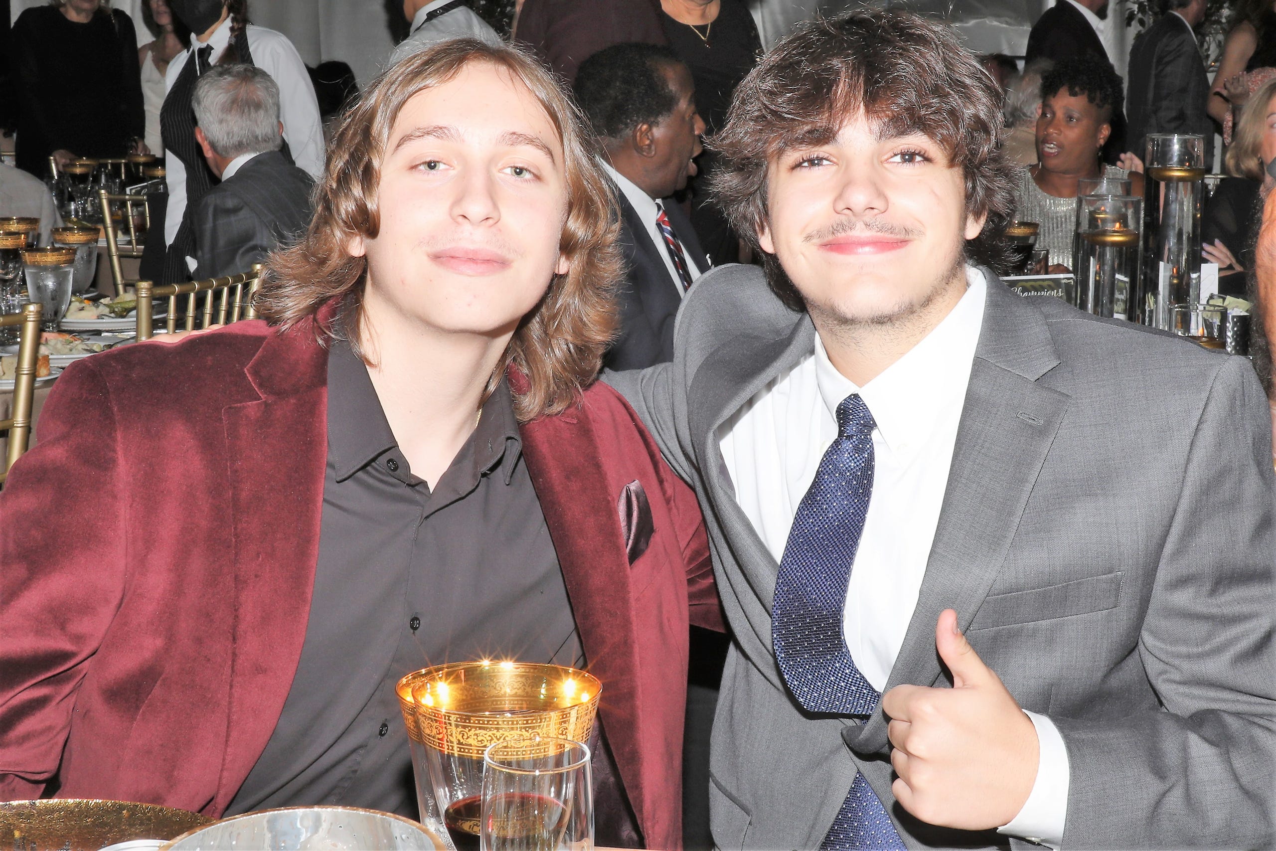 Dylan, 16 and Sam, 17 are all smiles as they celebrate their grandparents who are tonight's honorees Steven and Marjolaine Townsend.  Boys & Girls Clubs of Sarasota and DeSoto Counties held their Champions for Children Gala on November 20, 2021. Over 400 people came out to celebrate longtime supporters and donors Steven and Marjolaine Townsend who also have a scholarship fund in their name that has benefitted thirty-two college students since its inception in 2018. JANET COMBS/HERALD-TRIBUNE