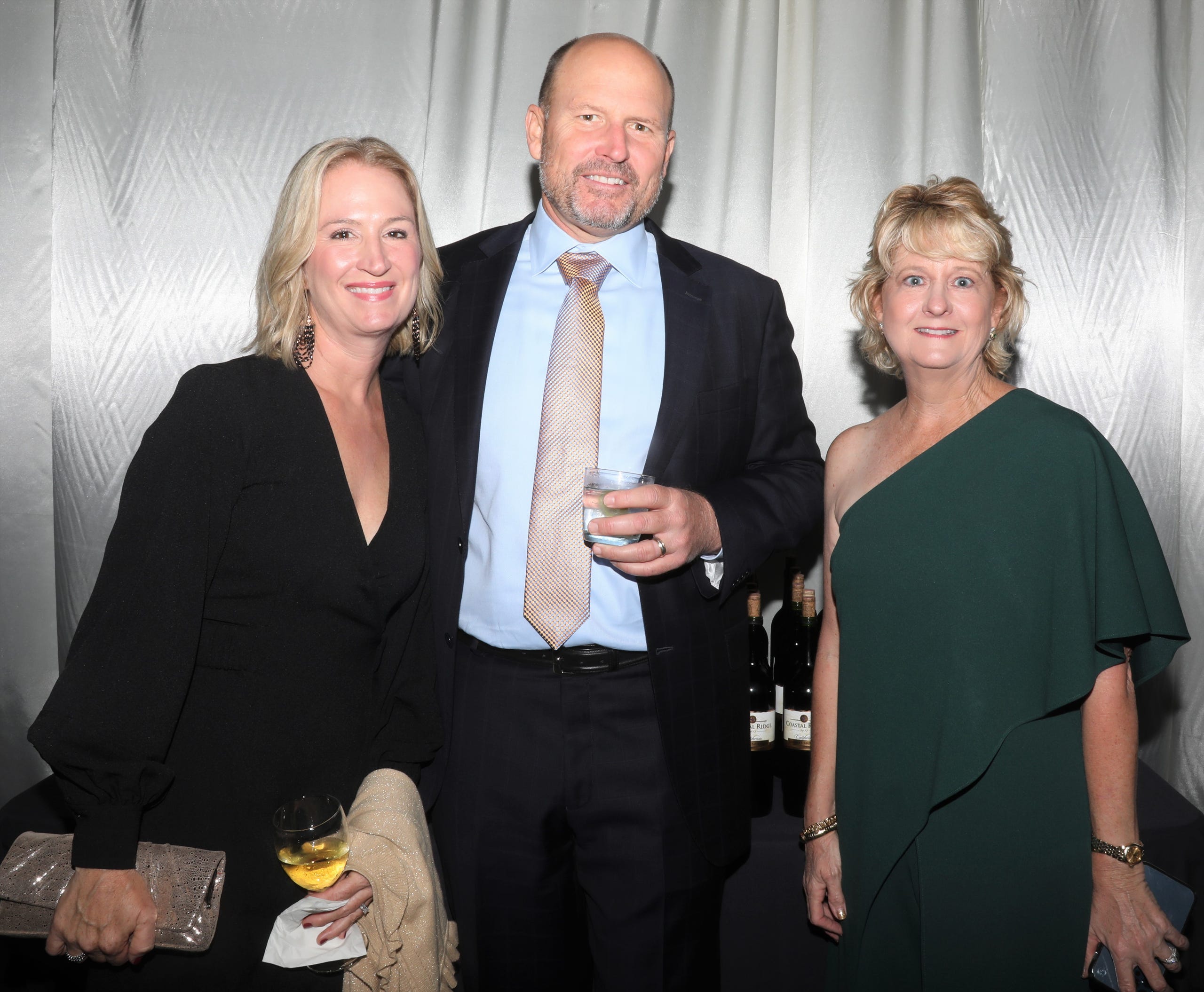 Katie and Rod Hollingsworth pose with Lisa Carlton before dinner.  The Boys & Girls Clubs of Sarasota and DeSoto Counties held their Champions for Children Gala on November 20, 2021. Over 400 people came out to celebrate longtime supporters and donors Steven and Marjolaine Townsend who also have a scholarship fund in their name that has benefitted thirty-two college students since its inception in 2018. JANET COMBS/HERALD-TRIBUNE
