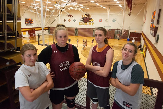Silver Lake returns four starters this year, from left, McKinley Kruger, MacKenzie McDaniel, Taylor Ross and Maria Farmer, smile from the gymnasium loft during practice.