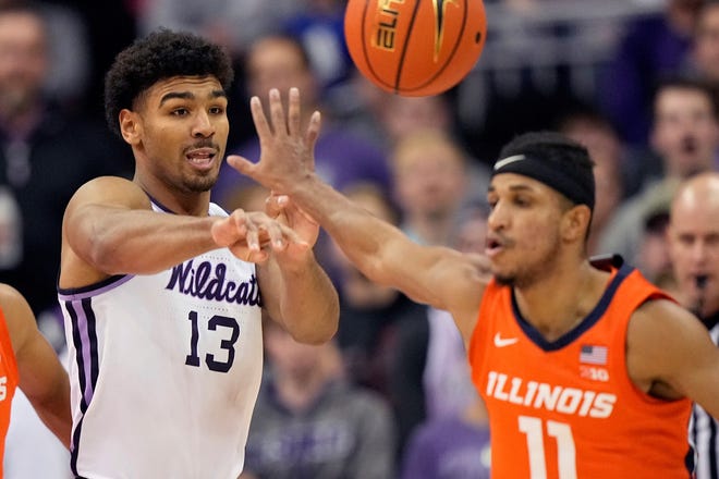 Kansas State's Mark Smith (13) passes around Illinois' Alfonso Plummer (11) during the second half Tuesday night at T-Mobile Center in Kansas City, Mo.