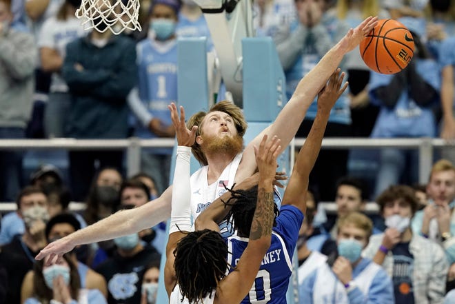 North Carolina forward Brady Manek blocks a shot by UNC Asheville guard Trent Stephney during Tuesday night’s game at the Smith Center.