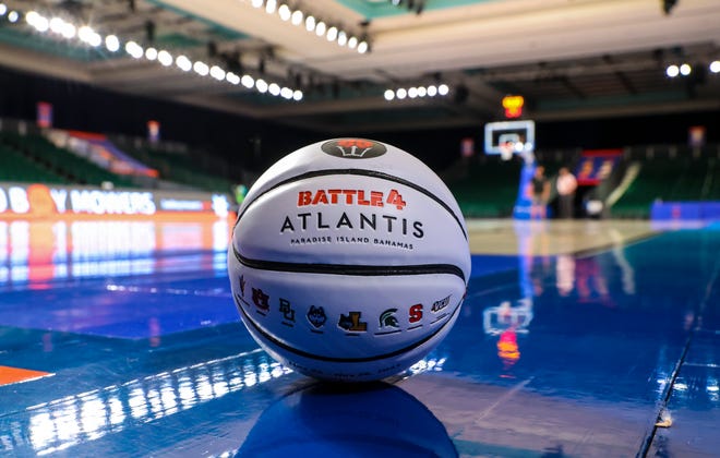 A basketball on the court with the participating teams Nov. 24, 2021 in the 2021 Battle 4 Atlantis tournament at Imperial Arena.