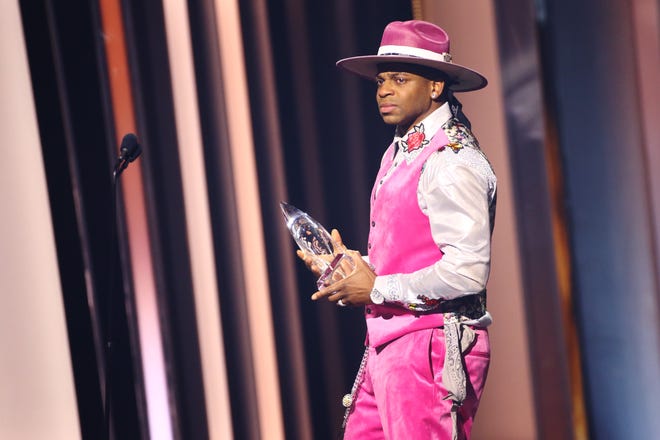 An emotional Jimmie Allen speaks on stage during the 55th annual Country Music Association awards in Nashville, after being named New Artist of the Year on Nov. 10