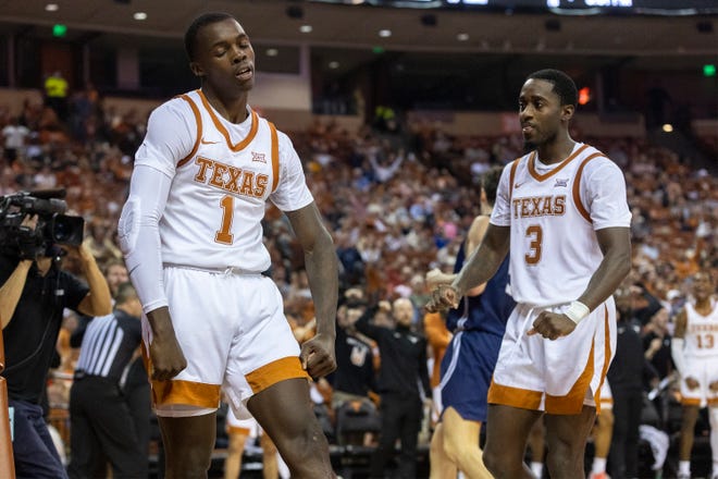 Texas guard Andrew Jones (1) and guard Courtney Ramey (3) celebrate scoring against California Baptist during a game at the Frank Erwin Center on Wednesday.