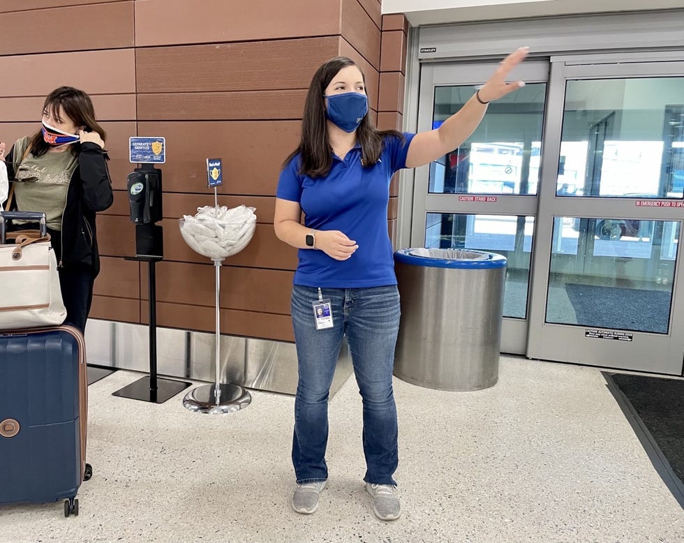 Amber Stewart, Nashville International Airport's maintenance coordinator, checks on the hand sanitizer and available masks during her morning inspection. 