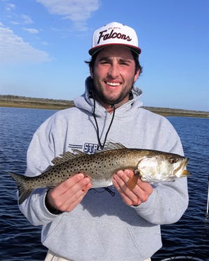 Stetson Hatcher of Macon Georgia, with a 22 -inch trout taken on Nov. 21, 2021.