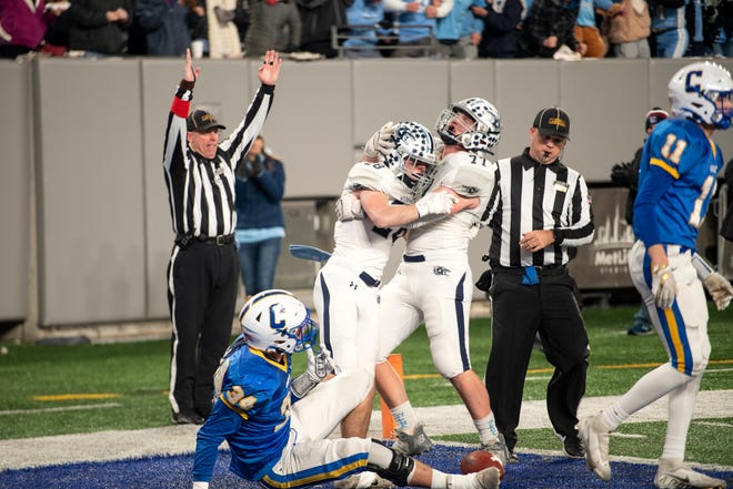 West Morris vs Cranford in the North, Group 3 regional championship game at MetLife Stadium on Friday, November 26, 2021. WM #28 Noah Turner celebrates with #77 Collin Leonhardt after scoring a touchdown in the second quarter. 