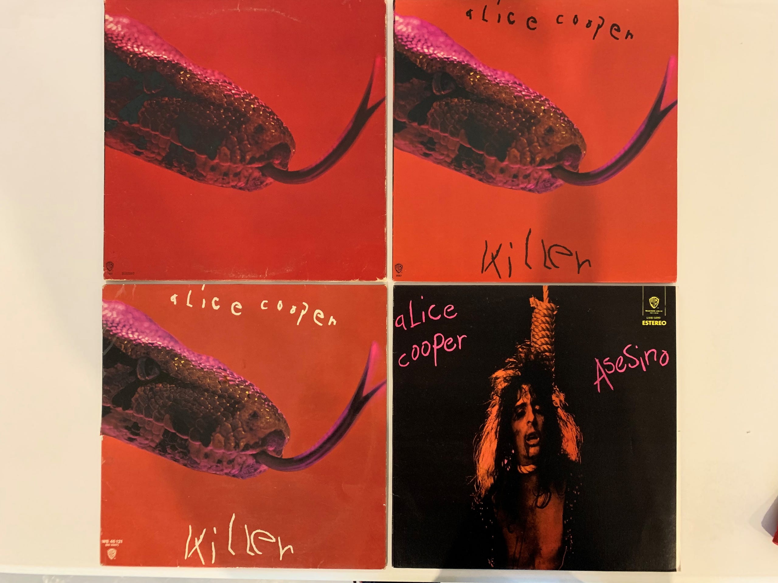 Four versions of the Alice Cooper "Killer" album art. Clockwise from upper left: Columbia House edition, standard U.S. issue, German issue and Mexican issue.